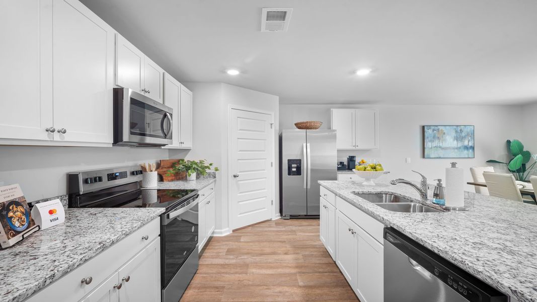 Furnished interior in a model home at The Groves at Bees Creek in Ridgeland (Image 20).