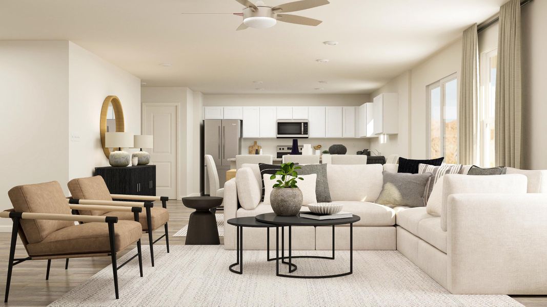 A living room with a white couch and a table.
