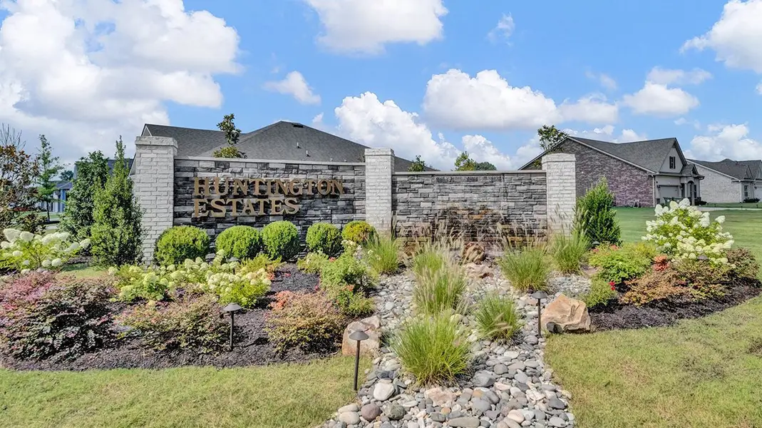 Entrance to the Huntington Estates community in Millington, TN, featuring signage and landscaping (Image 1).