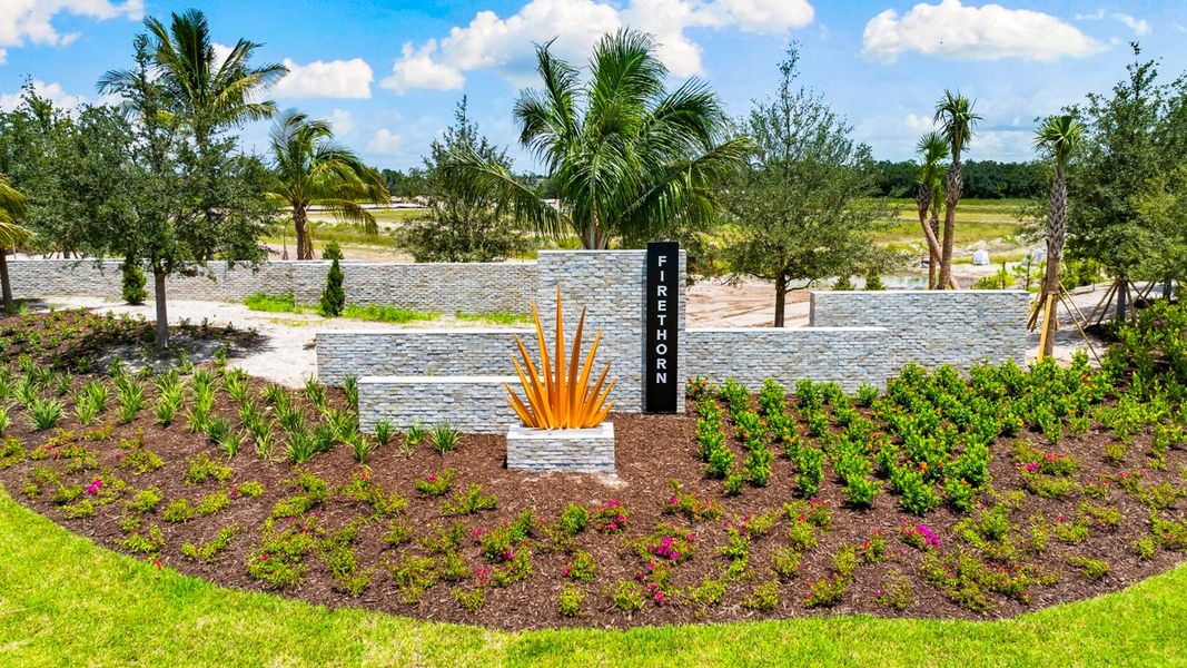 Entrance to the The Towns at Firethorn community in Parrish, FL, featuring signage and landscaping (Image 12).