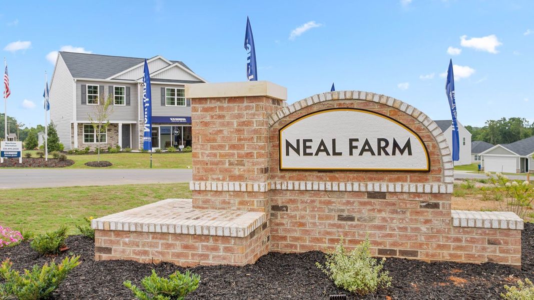 Entrance to the Neal Farm community in Stokesdale, NC, featuring signage and landscaping (Image 1).