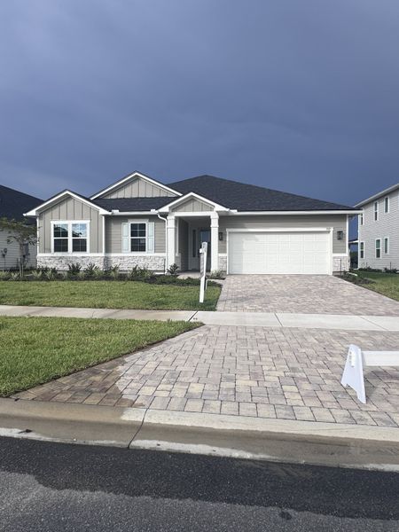 A charming single-story home with a paved driveway in TrailMark by Richmond American Homes (St. Augustine, FL).