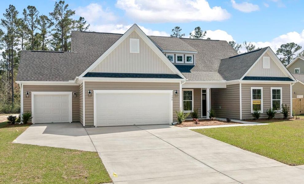 Front exterior of a home in the The Enclave at French Quarter Creek community, located in Huger, SC (Image 2).