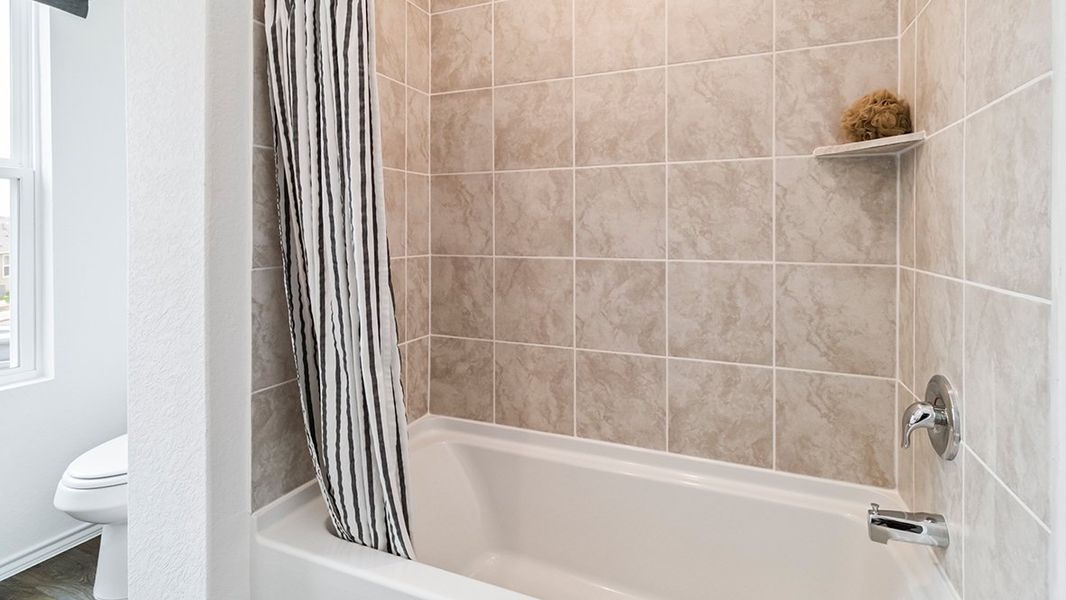 Furnished interior in a model home at Blue Ridge Ranch in San Antonio (Image 29).