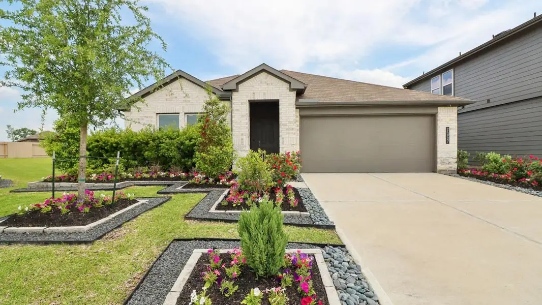 Front exterior of a home in the Grand Pines community, located in Magnolia, TX (Image 10).