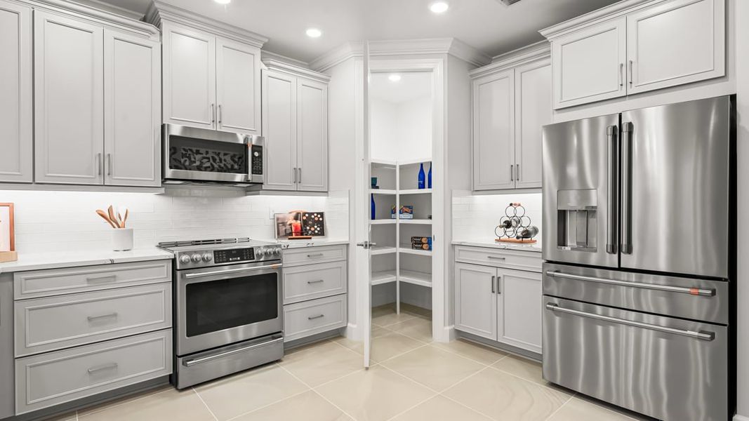 Furnished interior in a model home at Esplanade by the Islands Coach Homes in Naples (Image 72).