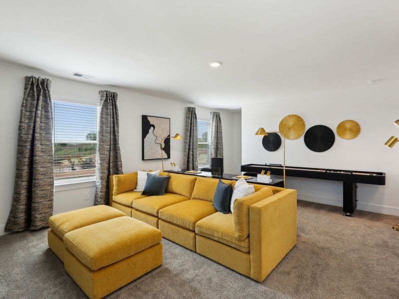 The bonus room offers a place for the kids to work on homework.