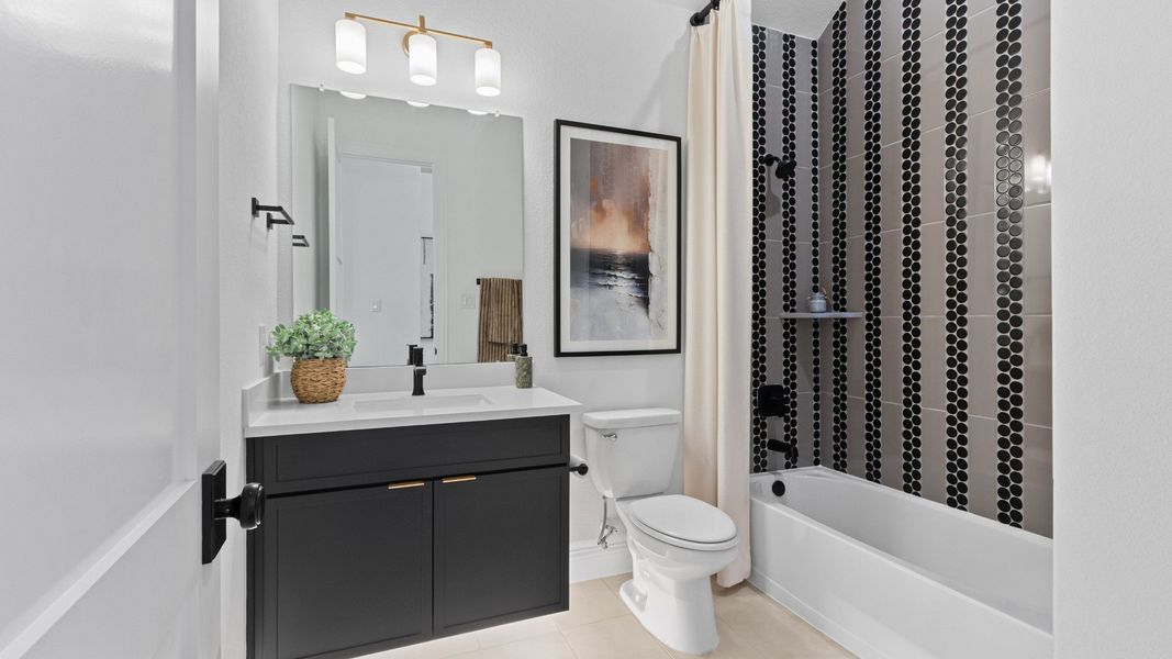 Furnished interior in a model home at Wildrye in Waller (Image 23).