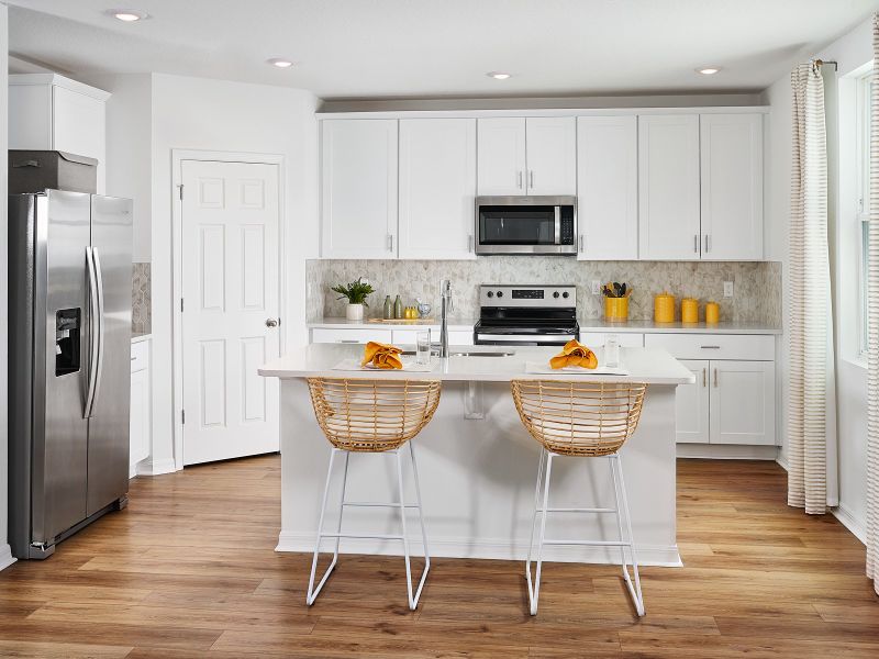 Kitchen of the Primrose plan modeled at The Meadow at Crossprairie