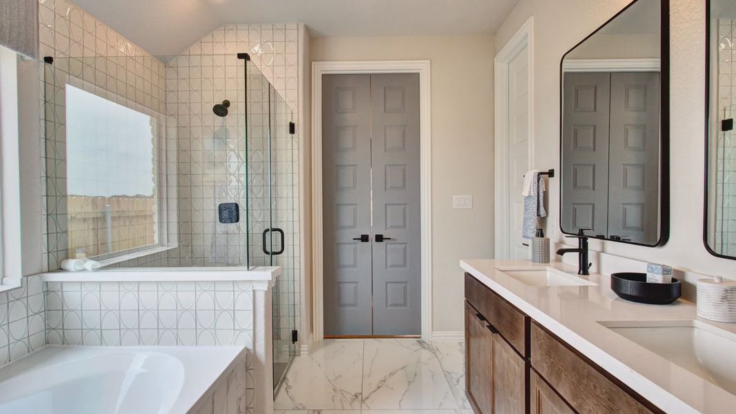 Experience opulence with marble floors, glass shower, and elegant design at Sunflower Ridge.