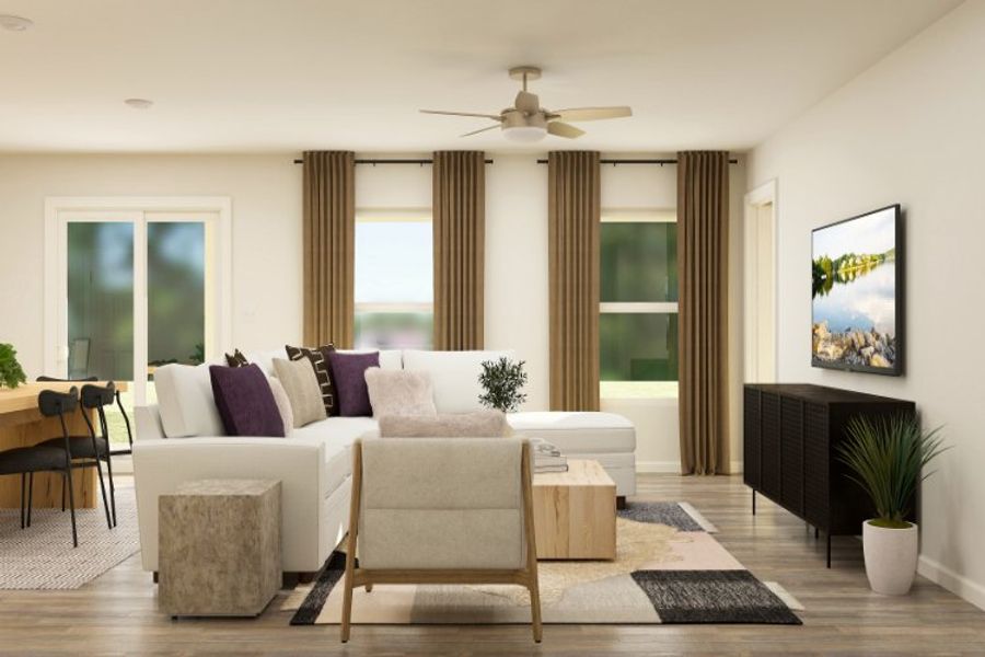 A living room with a fireplace and a large window. A living room with a fireplace and a large window.