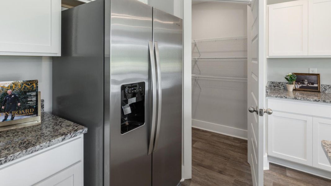 Furnished interior in a model home at Eagle Creek in Bolivia (Image 7).