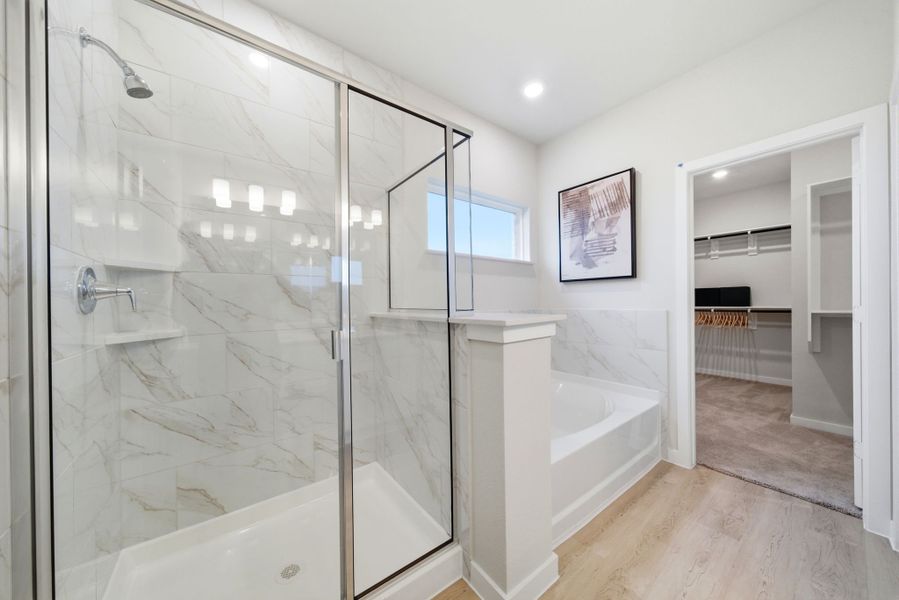 A bathroom with a glass shower. A bathroom with a glass shower.