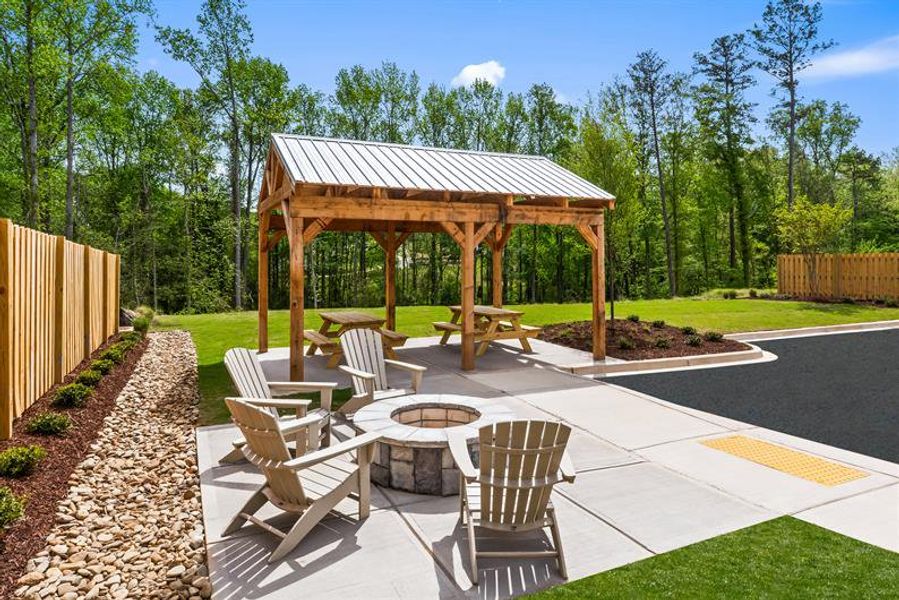 Enjoy sidewalks and a covered fireplace cabana, perfect for casual gatherings.