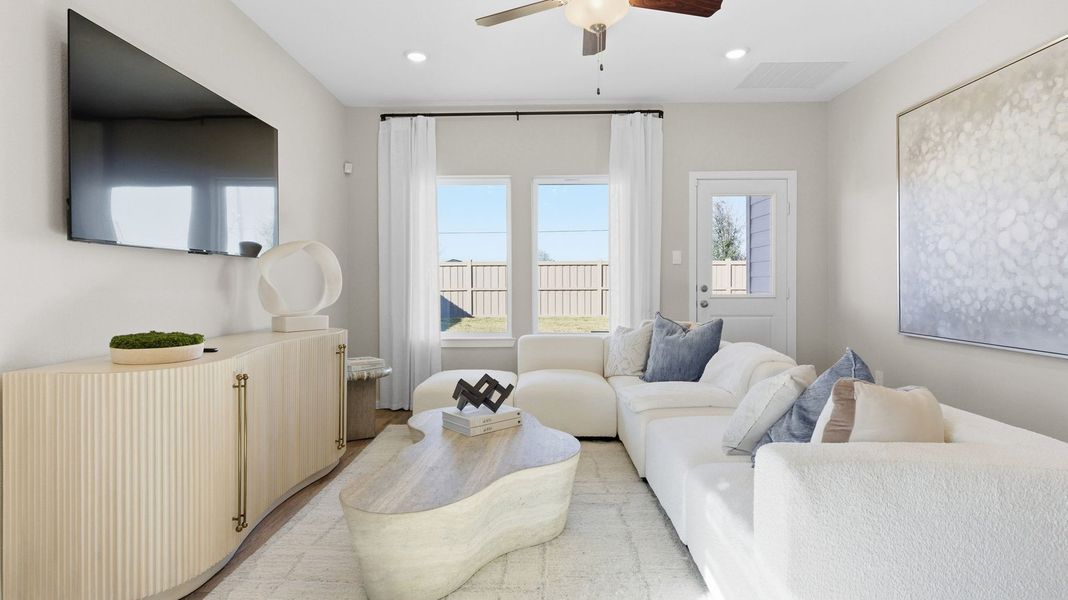 Furnished interior in a model home at Caldwell Crossing in Iowa Colony (Image 5).