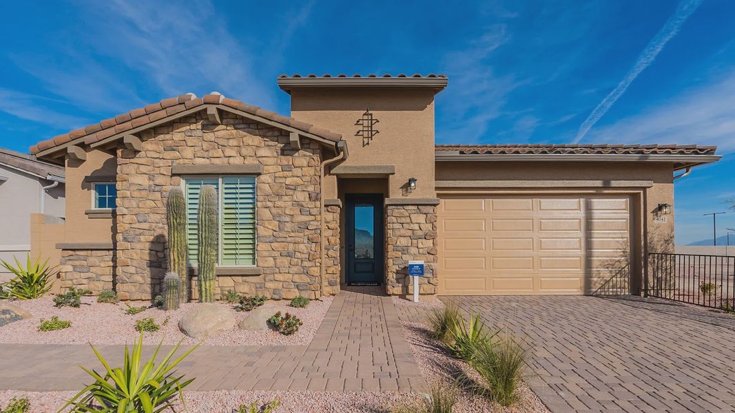 Elegant stone facade and desert landscaping in Arroyo Seco. Tiled roof adds timeless luxury. Elegant stone facade and desert landscaping in Arroyo Seco. Tiled roof adds timeless luxury.