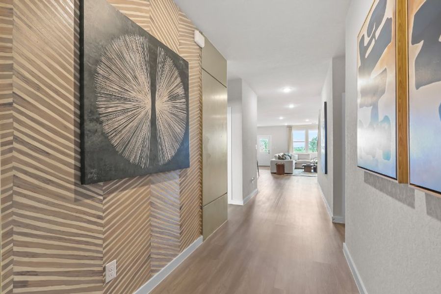 A long hallway with art on the walls. A long hallway with art on the walls.