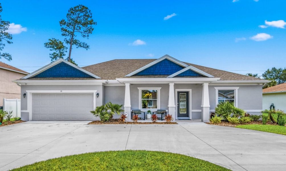 Front exterior of a home in the Palm Coast community, located in Palm Coast, FL (Image 2).