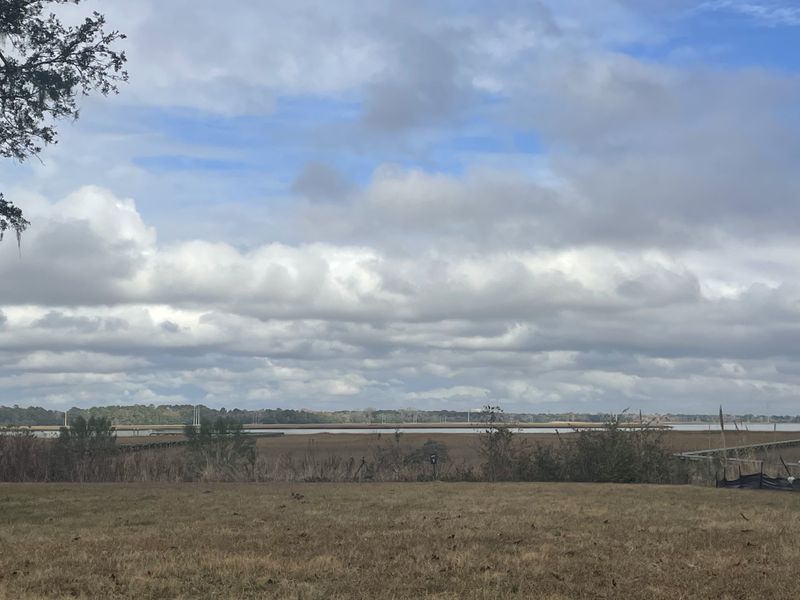 A scenic landscape with open fields and cloud-filled skies in The Settlement at Ashley Hall by Homes by Dickerson (Charleston, SC). A scenic landscape with open fields and cloud-filled skies in The Settlement at Ashley Hall by Homes by Dickerson (Charleston, SC).