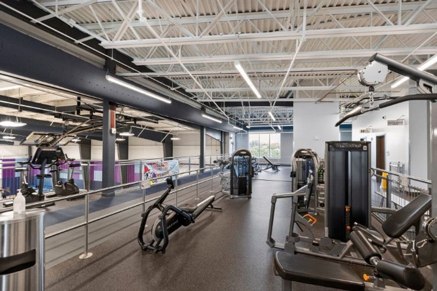 A gym with exercise equipment. A gym with exercise equipment.