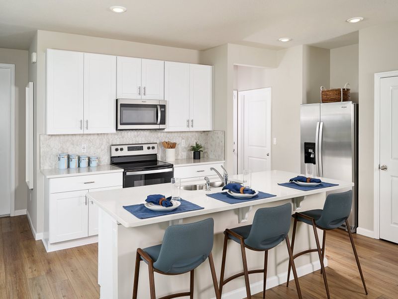 Kitchen in the Sandpiper floorplan modeled at Edgewater Pointe