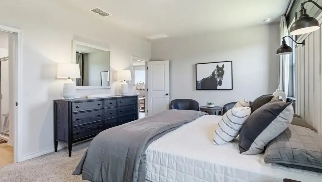 Furnished interior in a model home at The Woodlands at Medina Hills in Mico (Image 10).