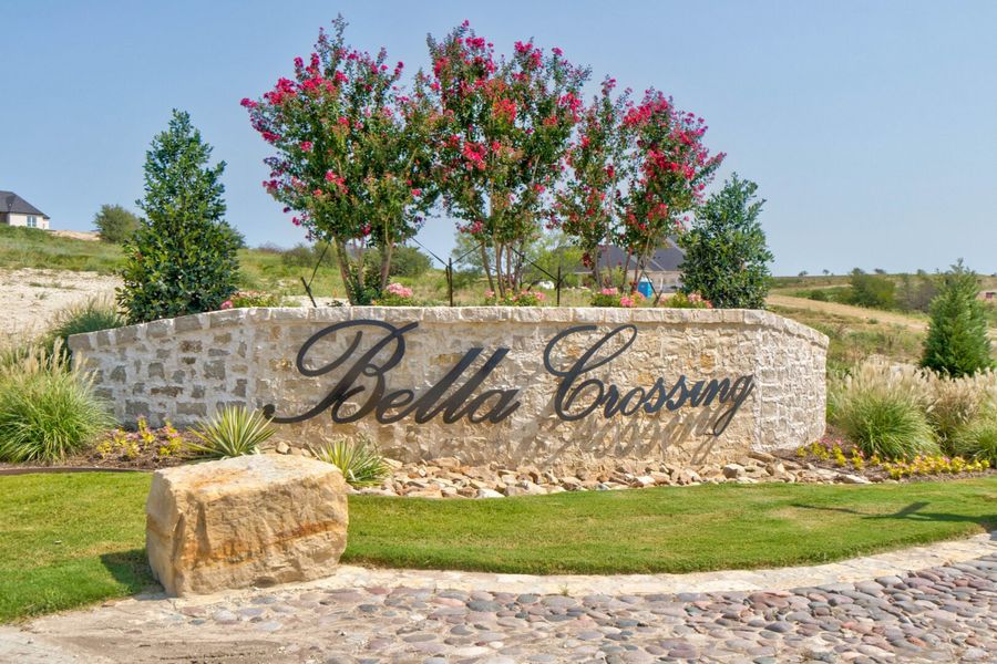 Main entrance to the Bella Communities master-planned community in Fort Worth, TX, featuring its landmark signage (Image 1).
