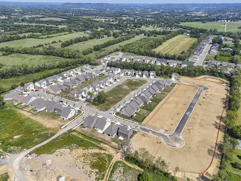 Aerial view of the Kensington Downs Single Family community in Gallatin, TN, showing layout and nearby surroundings (Image 14). Aerial view of the Kensington Downs Single Family community in Gallatin, TN, showing layout and nearby surroundings (Image 14).