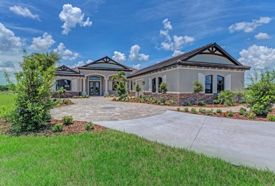 Front exterior of a home in the Hampton Lakes community, located in Sarasota, FL (Image 5). Front exterior of a home in the Hampton Lakes community, located in Sarasota, FL (Image 5).