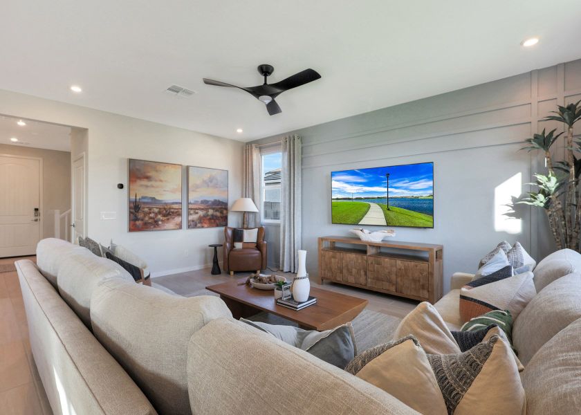 A living room with a large television. A living room with a large television.