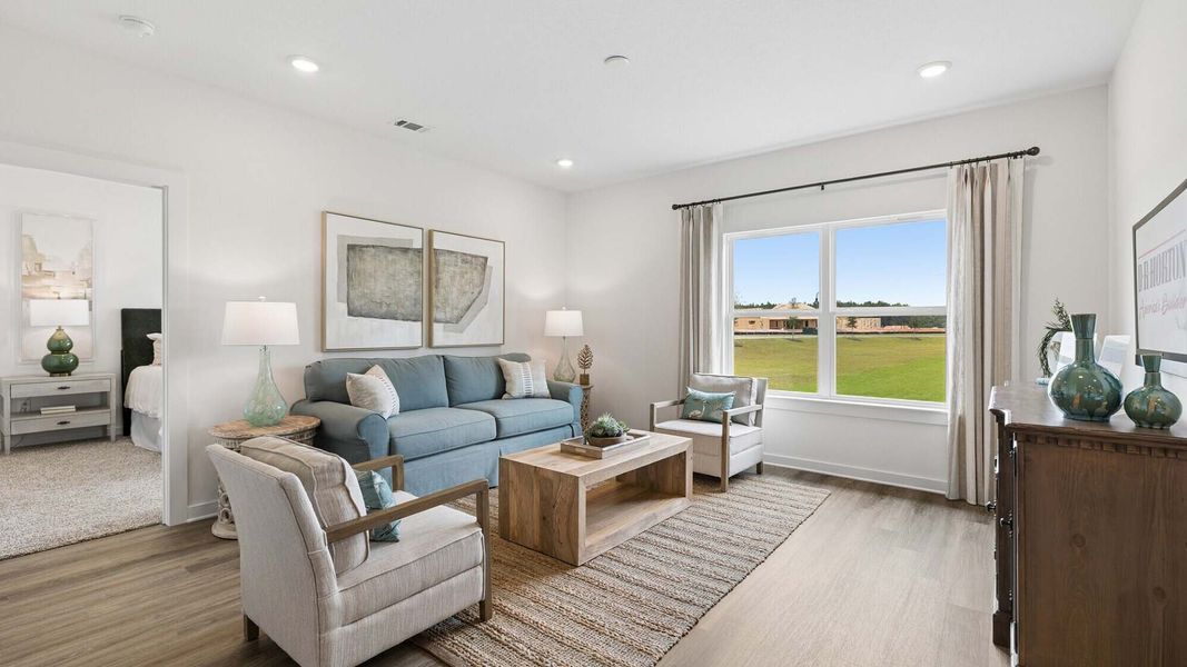 Furnished interior in a model home at Ashton Park Phase III in Freeport (Image 6).