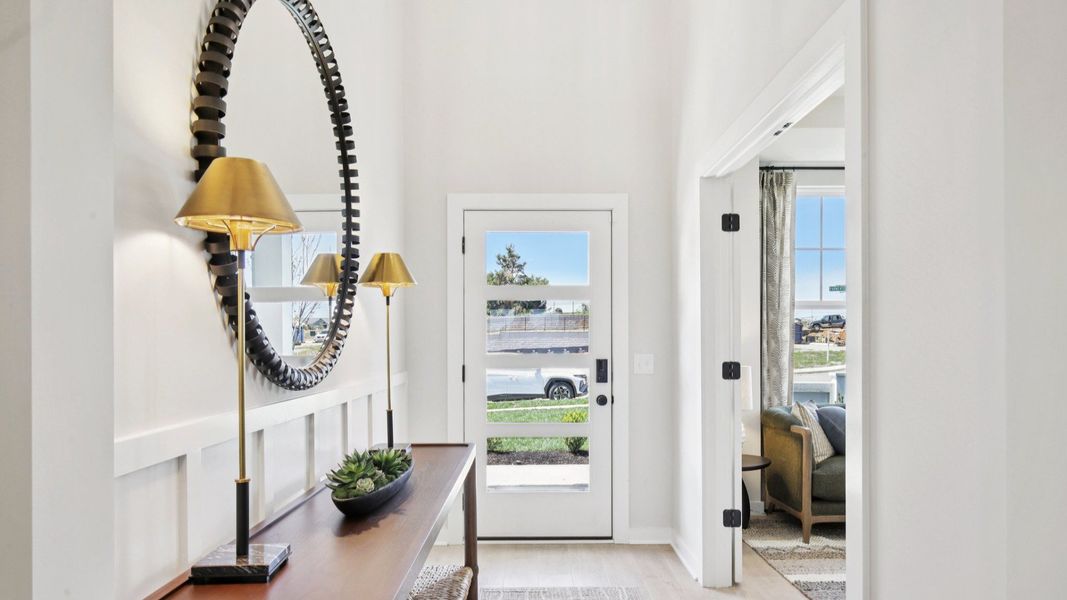 Entryway with upgraded front door and nearby study