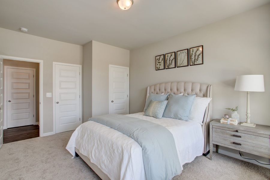 Furnished interior in a model home at Legends at Old Monroe in Monroe (Image 23).