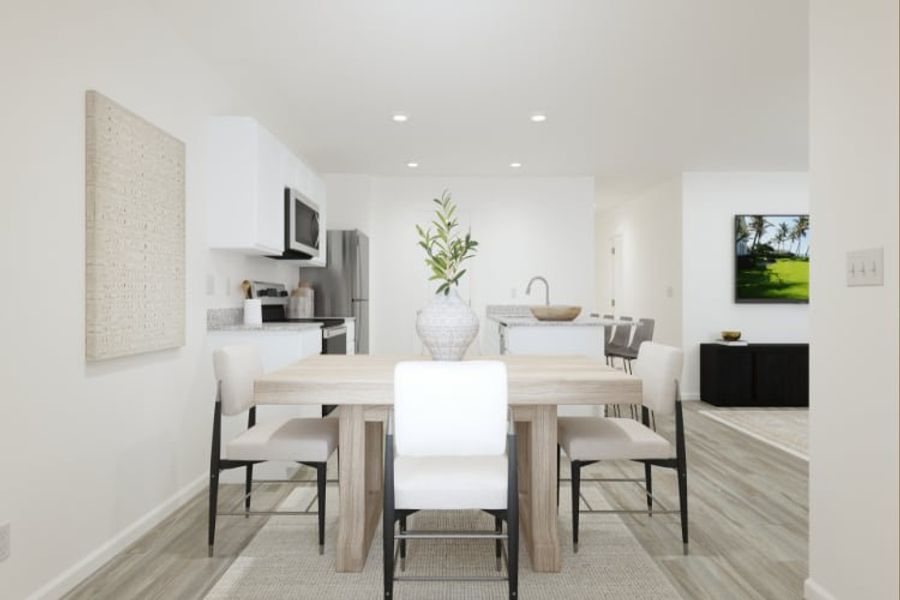 A dining room with a table and chairs. A dining room with a table and chairs.