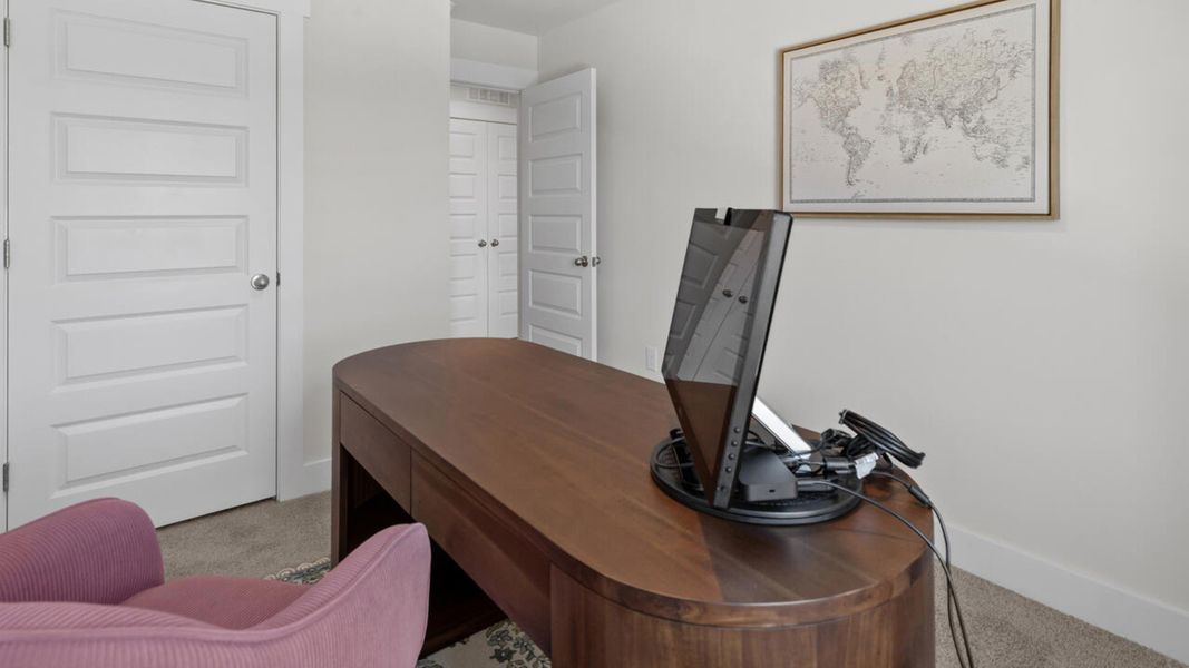 Furnished interior in a model home at Waterside Townhomes in Surf City (Image 25).