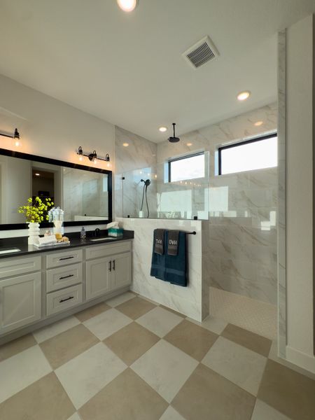 A spacious bathroom featuring a sleek glass shower, marble accents, and modern lighting for a touch of elegance and comfort. A spacious bathroom featuring a sleek glass shower, marble accents, and modern lighting for a touch of elegance and comfort.