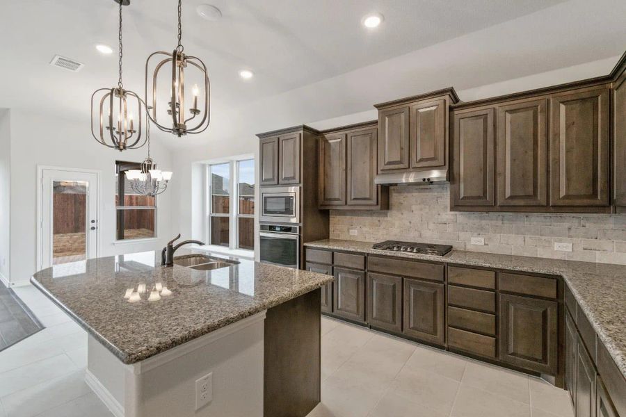 Kitchen | Concept 1841 at Coyote Crossing in Godley, TX by Landsea Homes