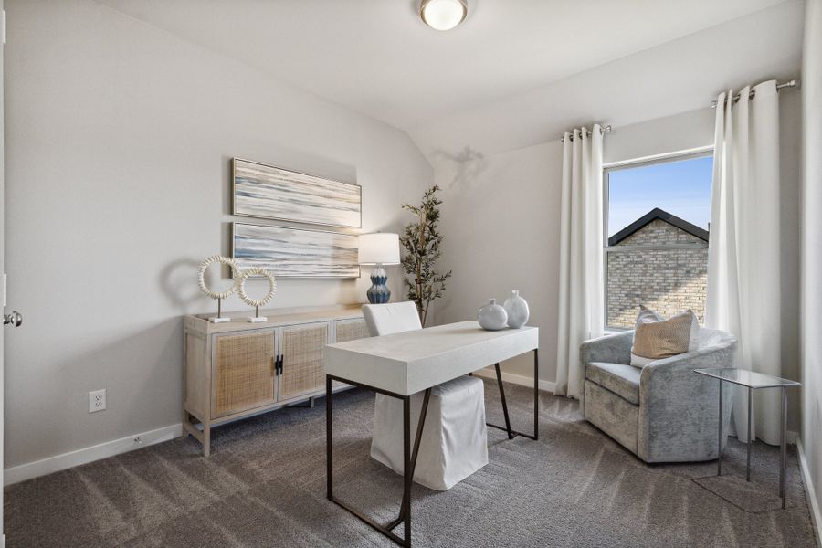 Bedroom/ Home Office in an Oak Model Home by Trophy Signature Homes