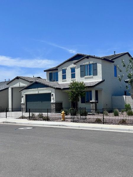 A modern two-story home with a fenced yard in Laveen Vistas II by Homes by Towne (Phoenix, AZ). A modern two-story home with a fenced yard in Laveen Vistas II by Homes by Towne (Phoenix, AZ).