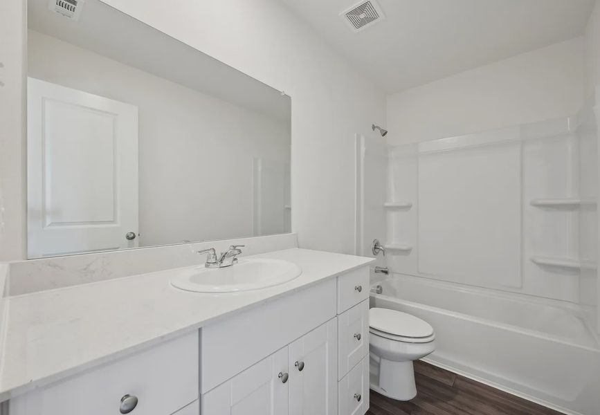 Furnished interior in a model home at Sutton Farms in San Antonio (Image 18).