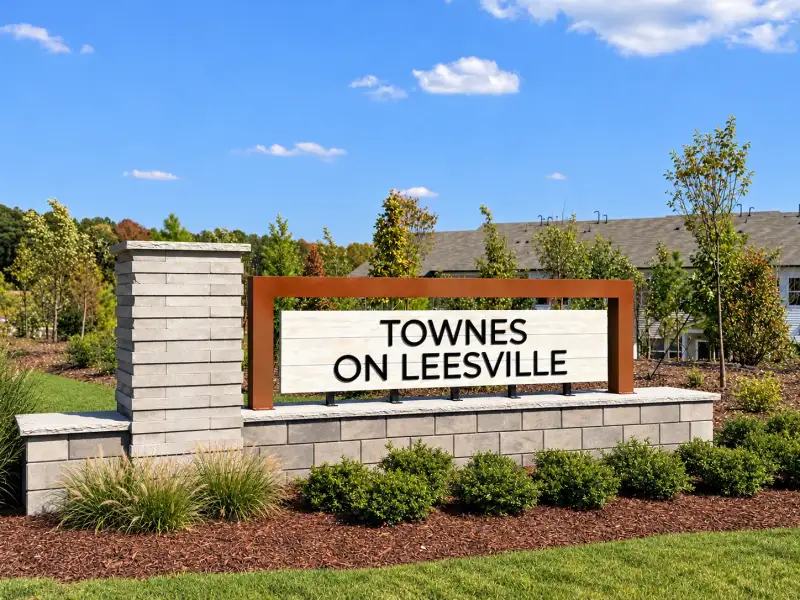 Entrance to the Townes on Leesville community in Durham, NC, featuring signage and landscaping (Image 1). Entrance to the Townes on Leesville community in Durham, NC, featuring signage and landscaping (Image 1).