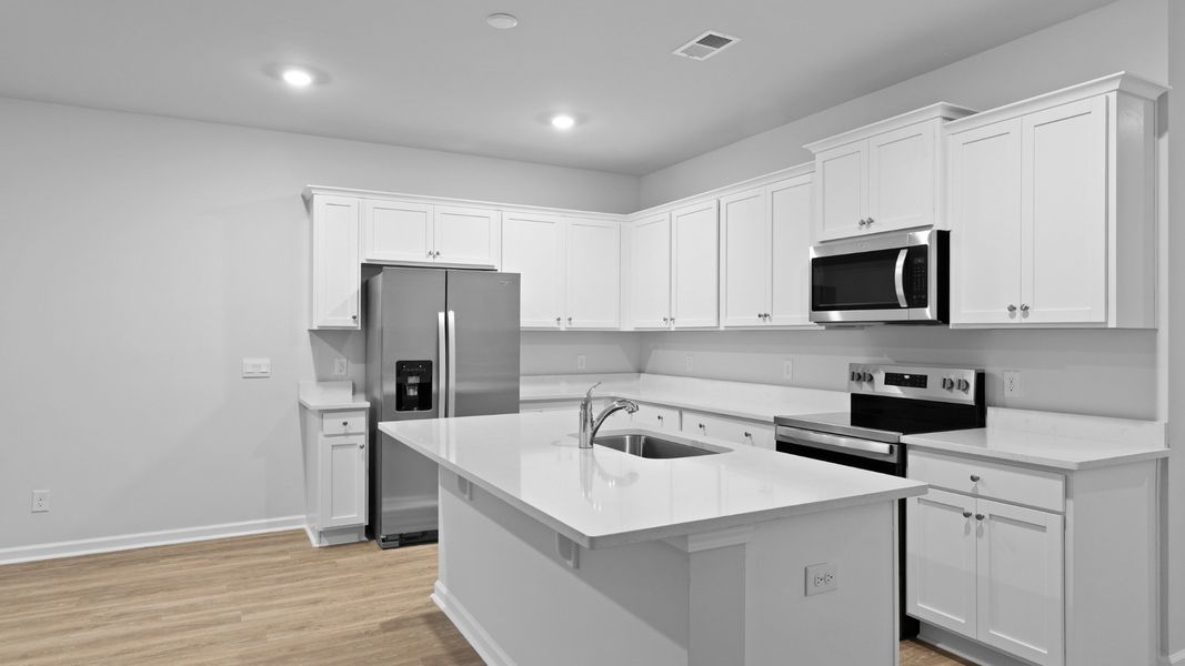 Furnished interior in a model home at Garbon Fields in Summerville (Image 7).