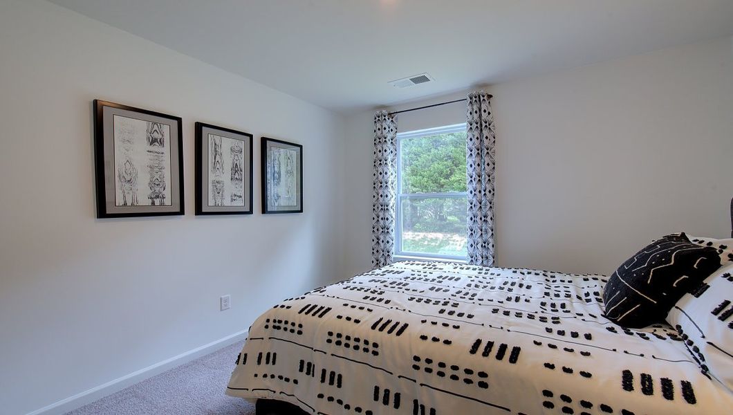 Furnished interior in a model home at Heritage Park in Fletcher (Image 37).