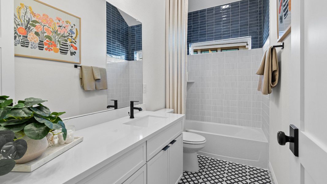 Furnished interior in a model home at Wildrye in Waller (Image 31).