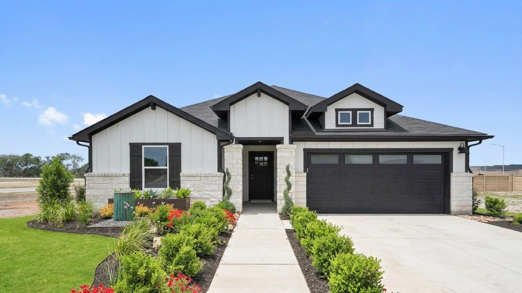 Front exterior of a home in the Monarch Ranch community, located in Manor, TX (Image 14).