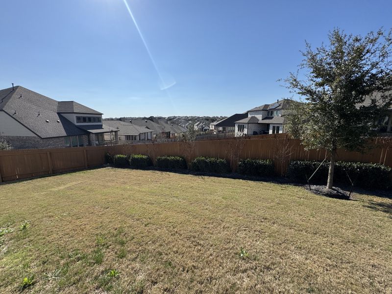 Expansive fenced backyard with scenic views in Weston Oaks by Highland Homes, San Antonio, TX. Expansive fenced backyard with scenic views in Weston Oaks by Highland Homes, San Antonio, TX.