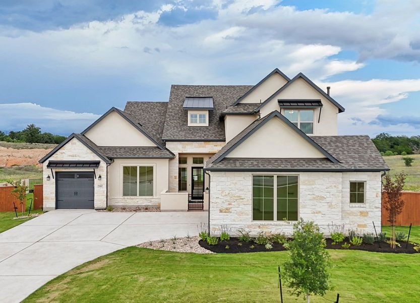Front exterior of a home in the The Colony- Driscoll Bluffs community, located in Bastrop, TX (Image 1).