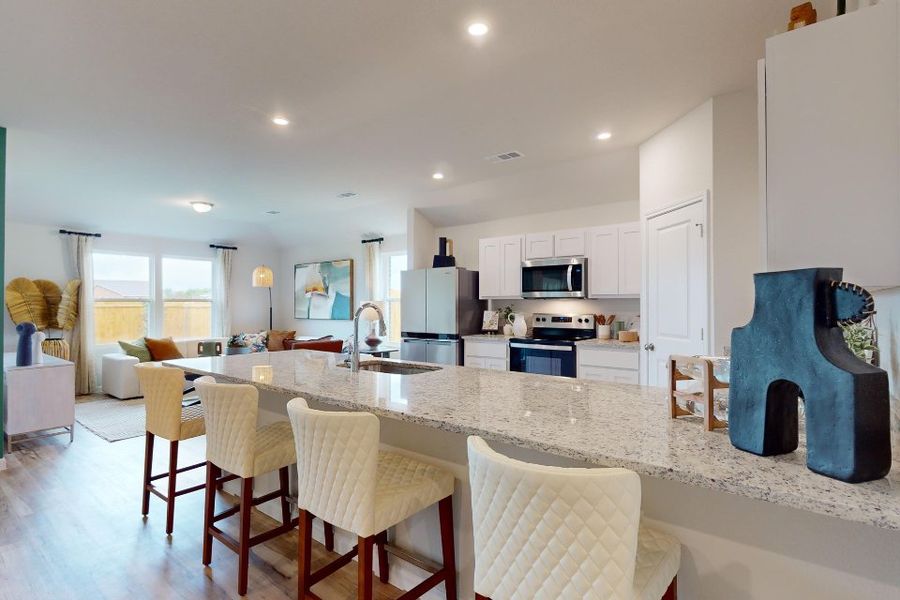 A kitchen with a marble island. A kitchen with a marble island.