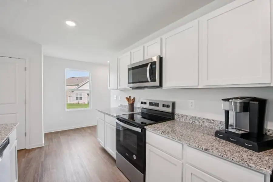 A kitchen with white cabinets. A kitchen with white cabinets.