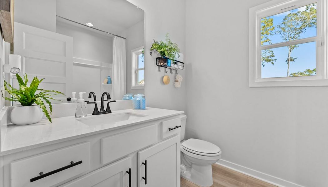 Furnished interior in a model home at Rosewood Lake Preserve in Hoschton (Image 8).